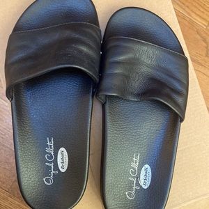 Black leather slide with gold rivets